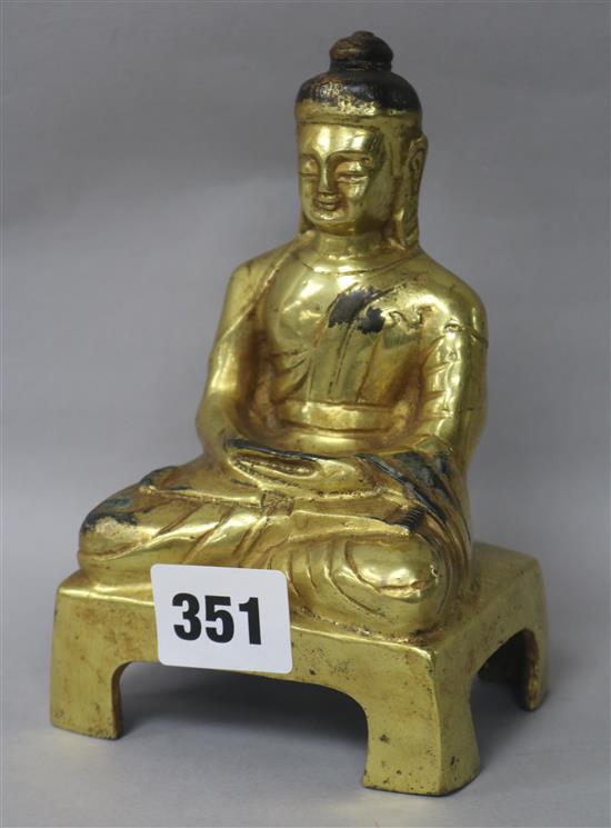 A Chinese gilt bronze figure of Buddha